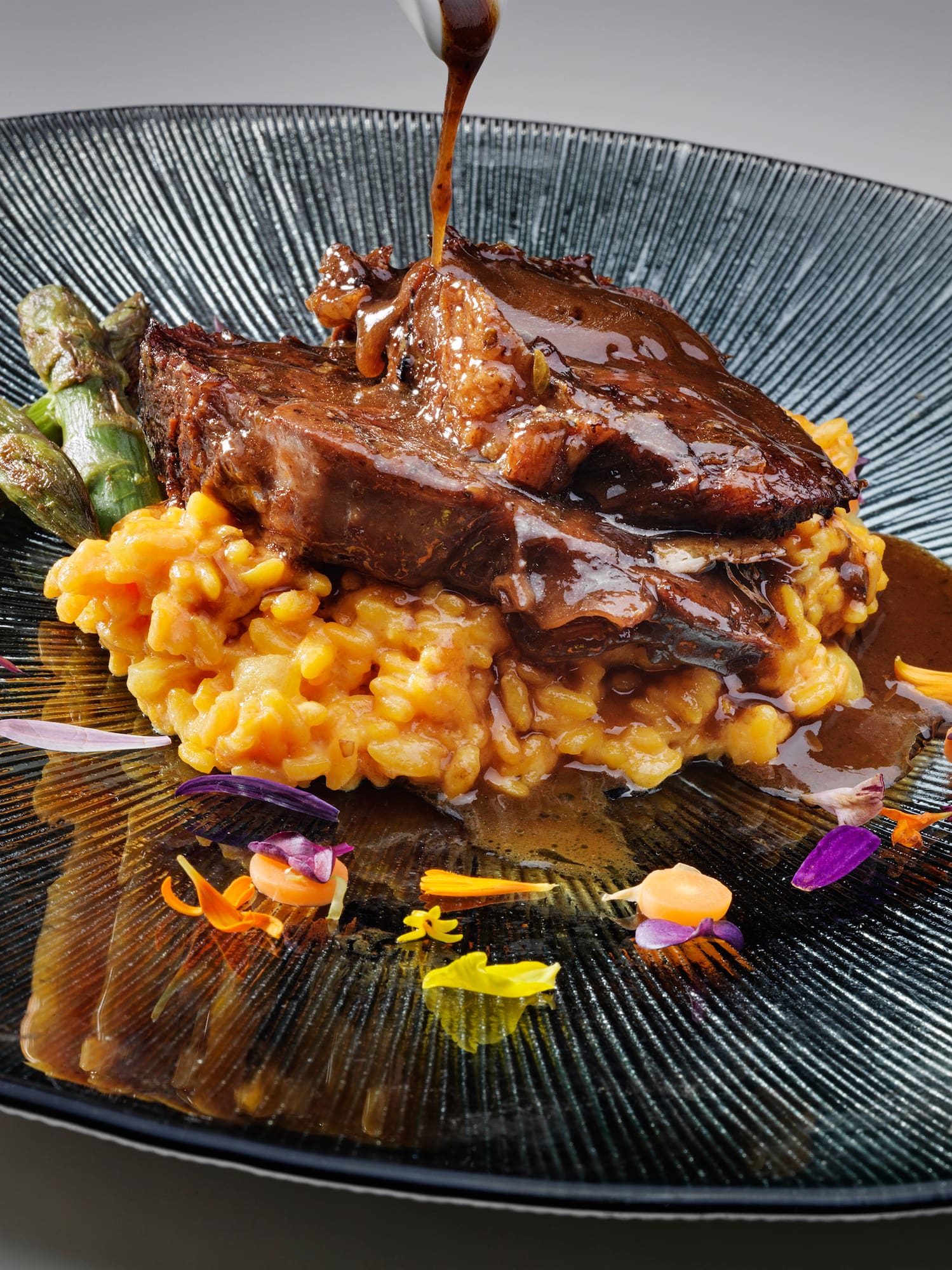 a plate of food with sauce on it