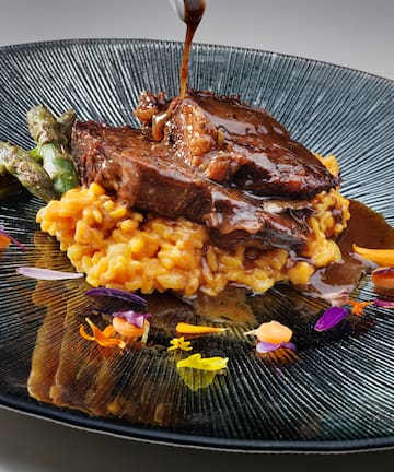 a plate of food with sauce on it