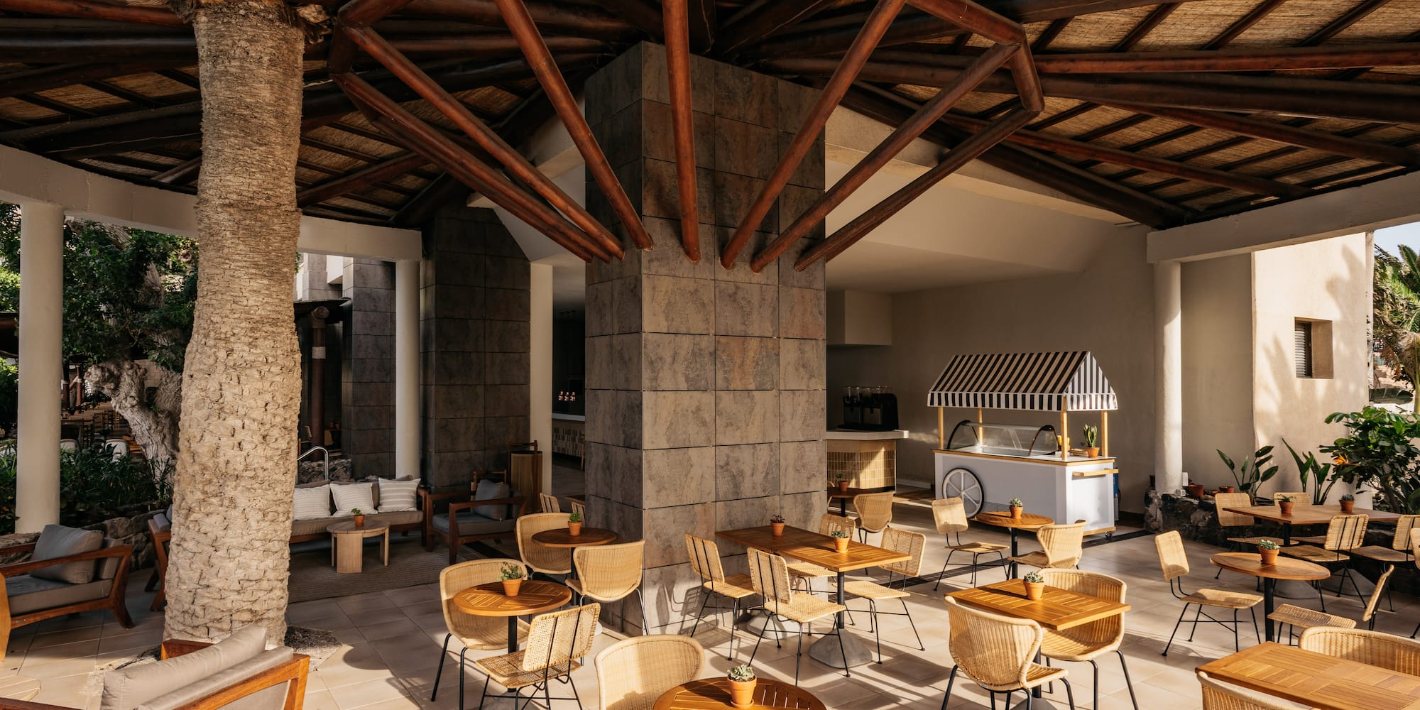 a patio with tables and chairs