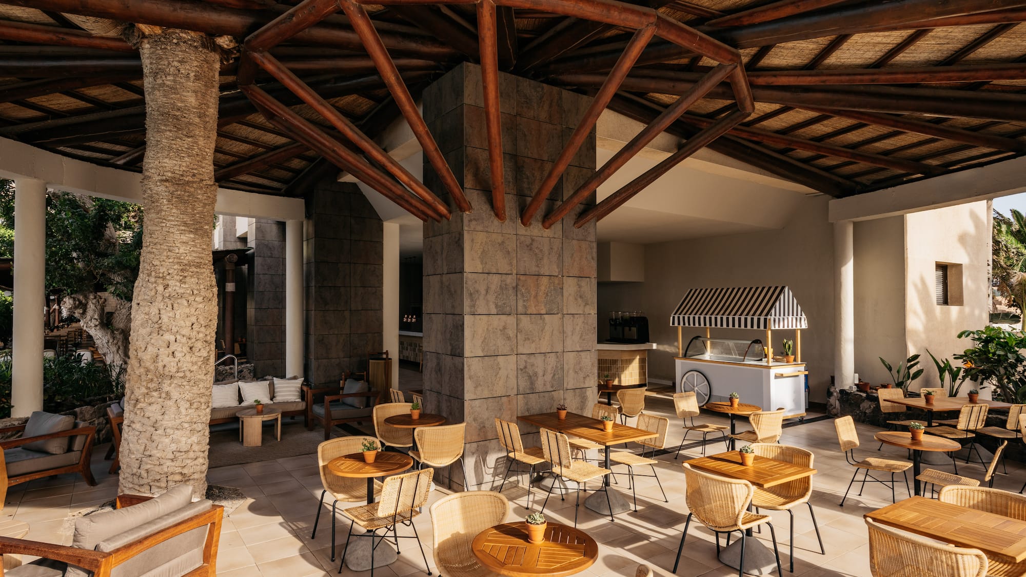 a patio with tables and chairs