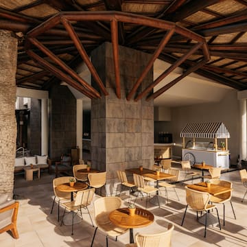 a patio with tables and chairs