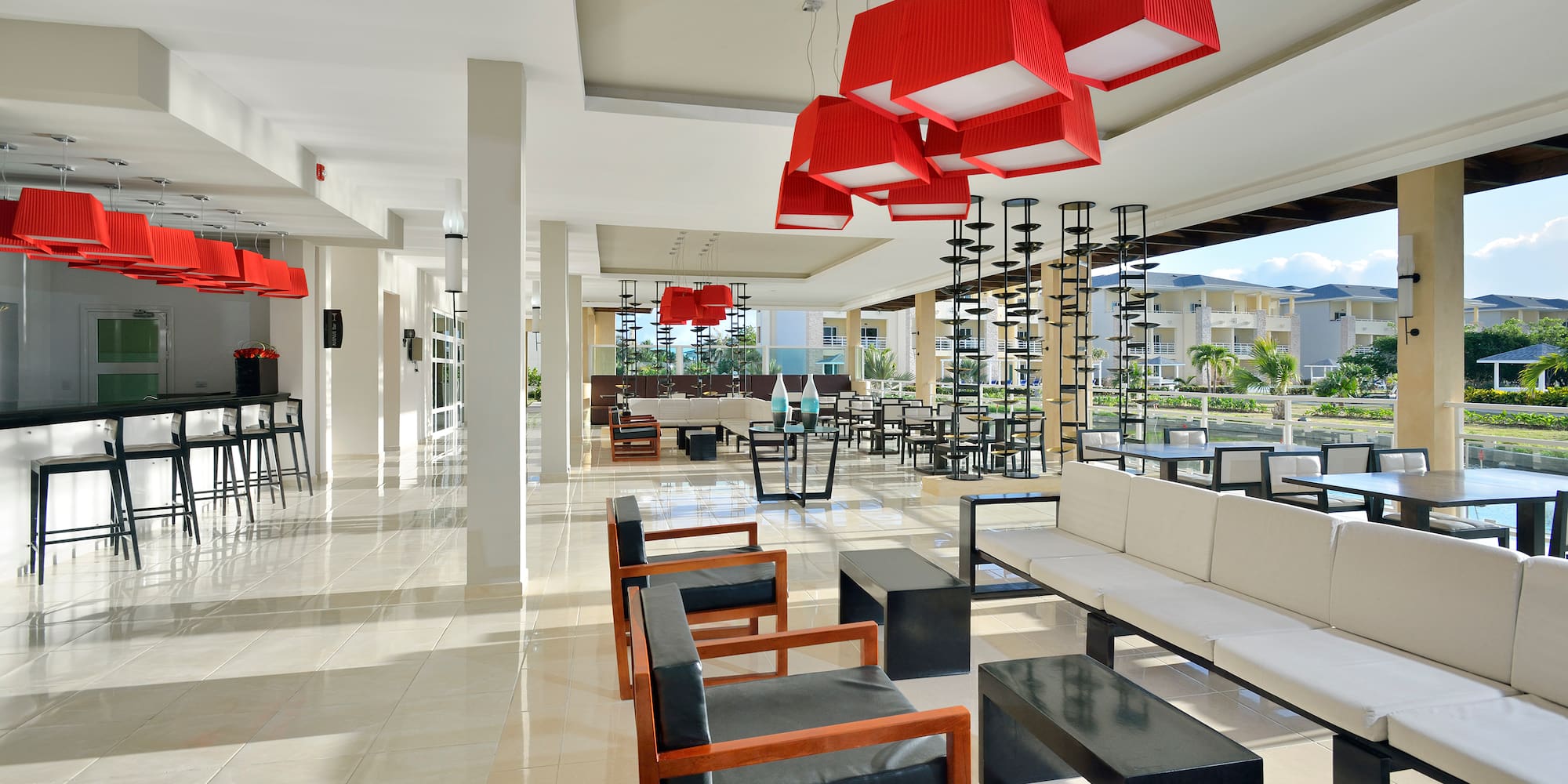 a room with chairs and a red chandelier