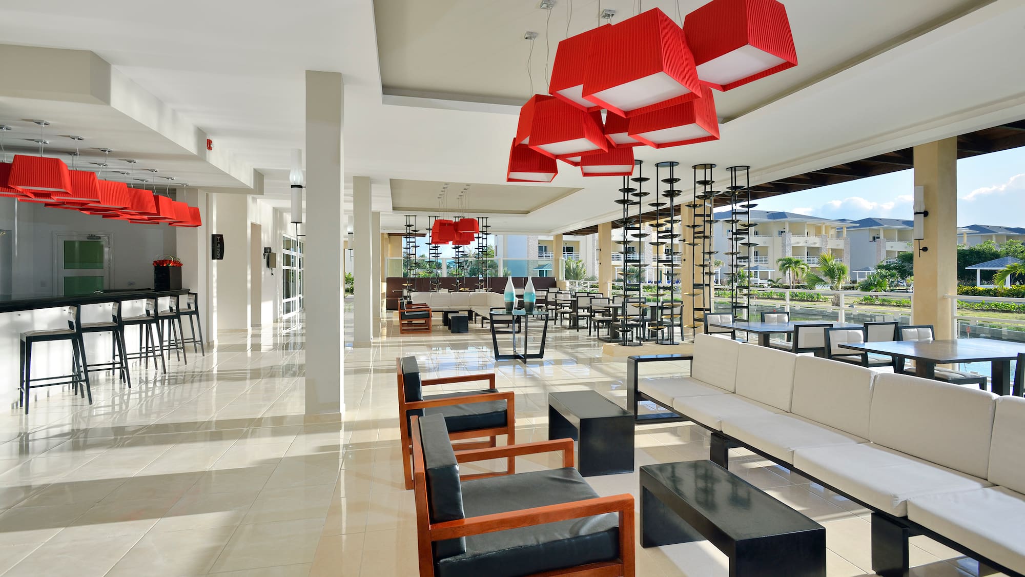 a room with chairs and a red chandelier