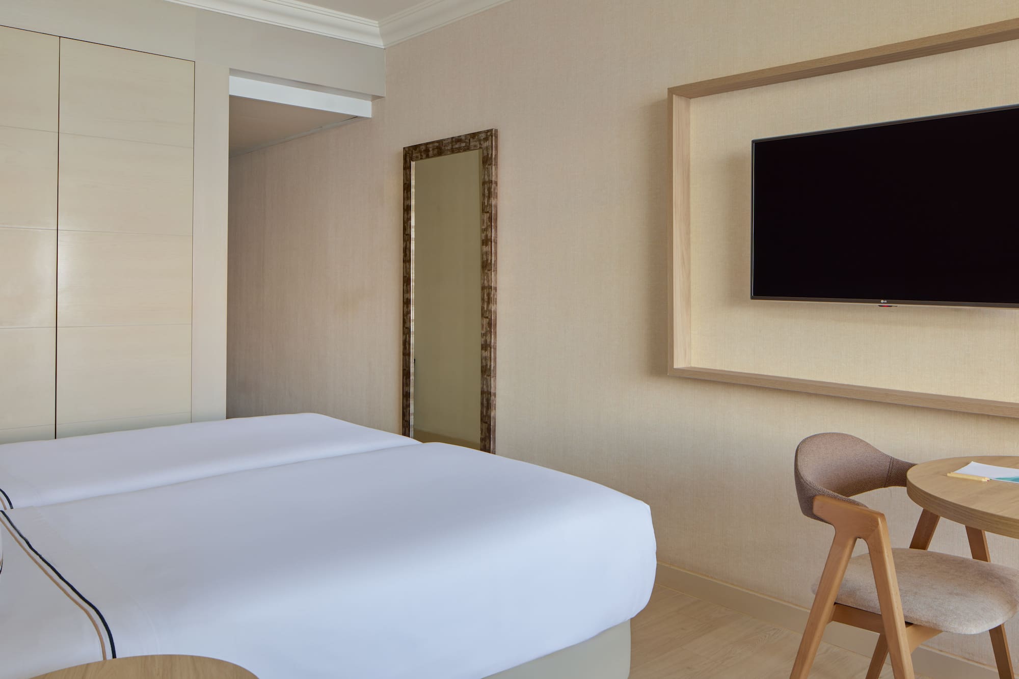 a room with a bed and a chair