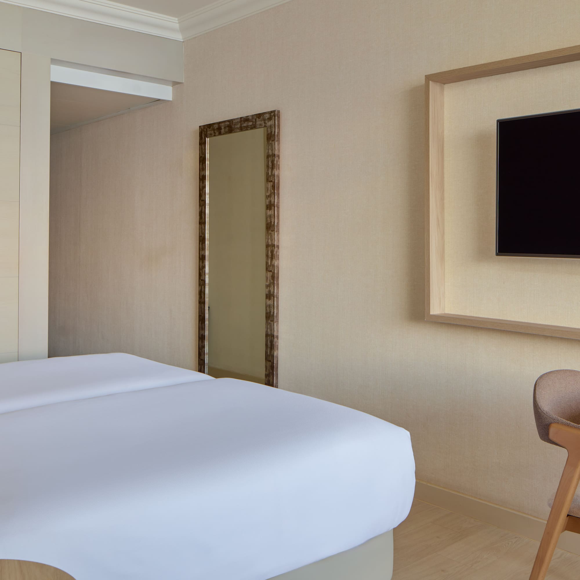 a room with a bed and a chair