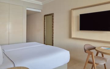 a room with a bed and a chair