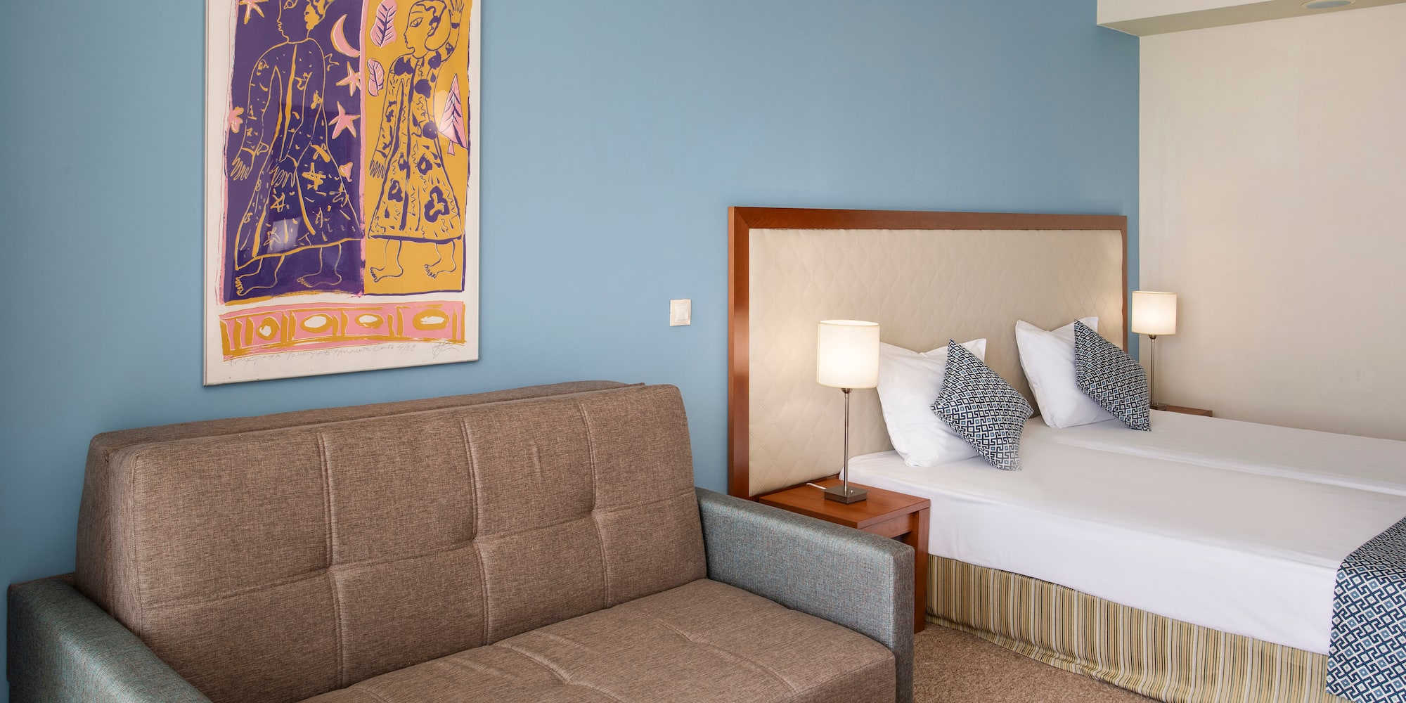 a room with a couch and a bed