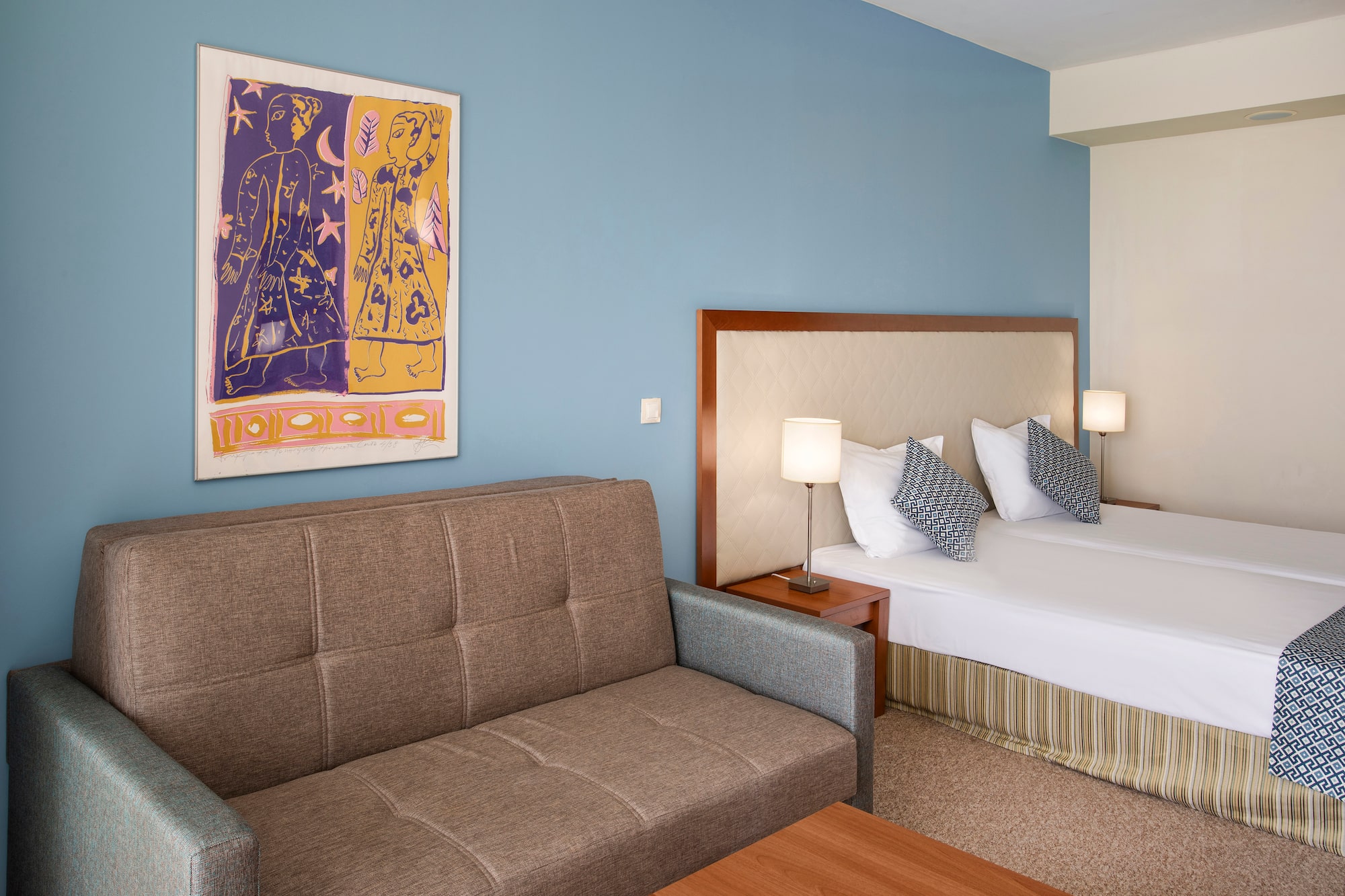 a room with a couch and a bed