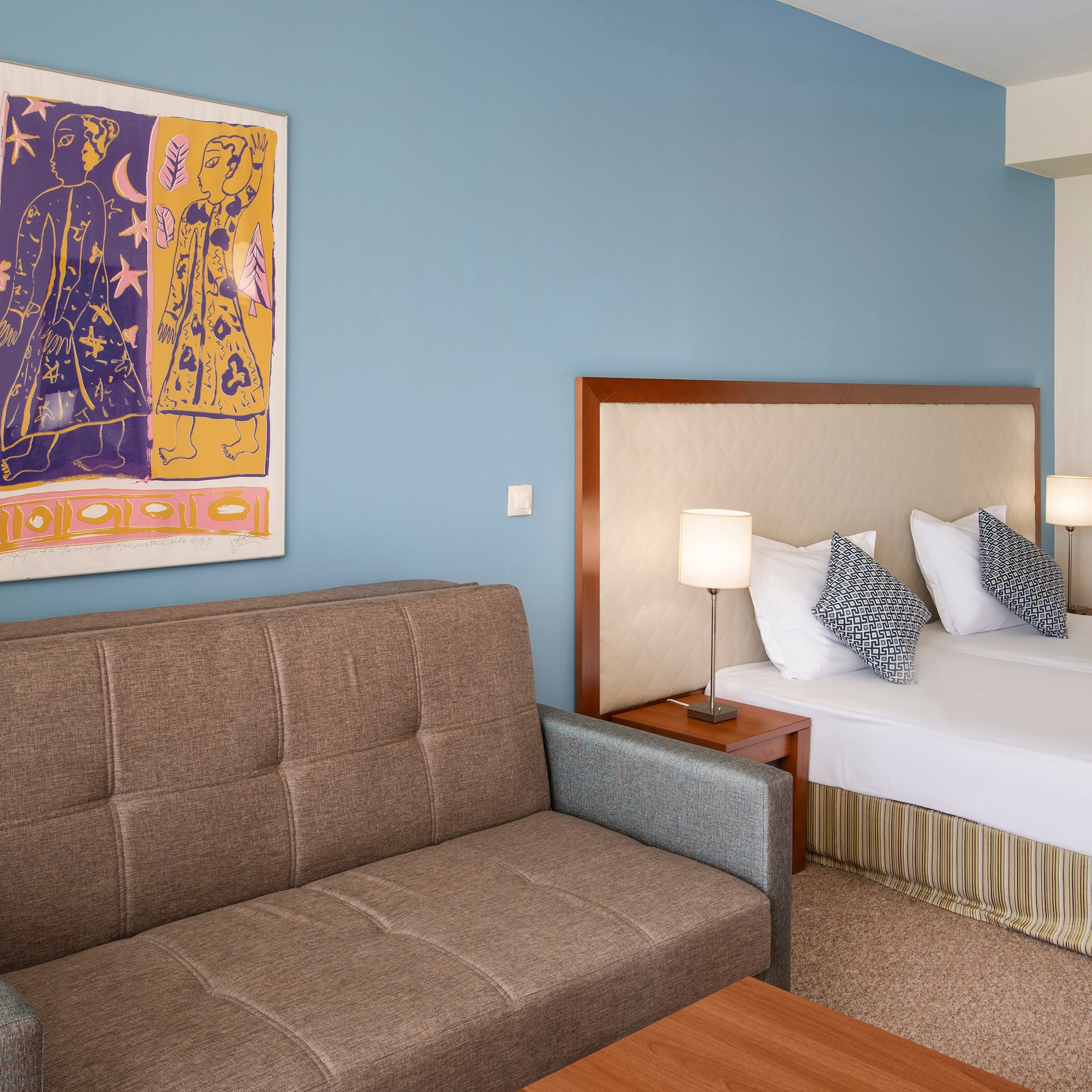 a room with a couch and a bed