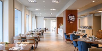 a restaurant with tables and chairs