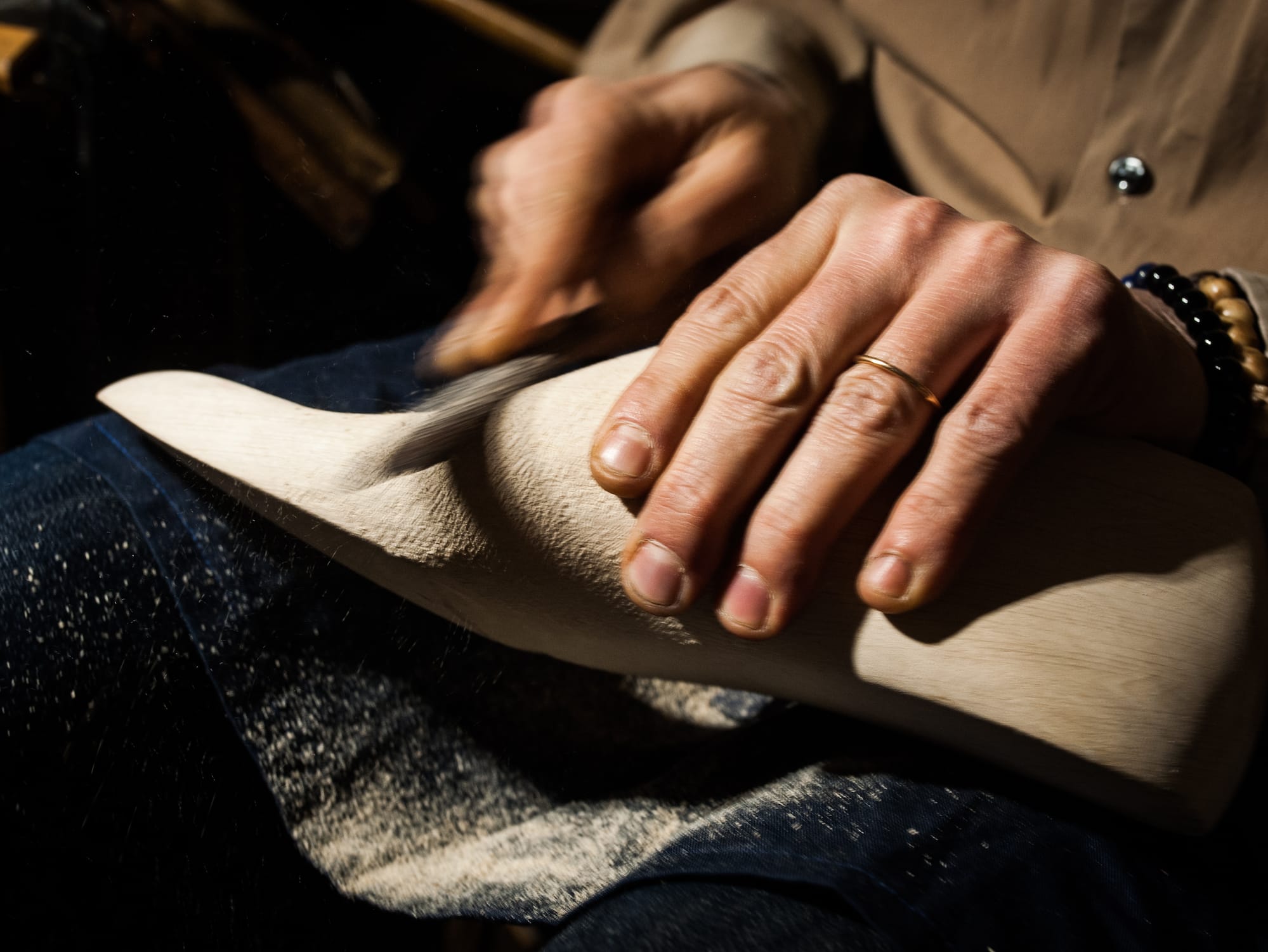 a person using a sand cutter to clean a foot