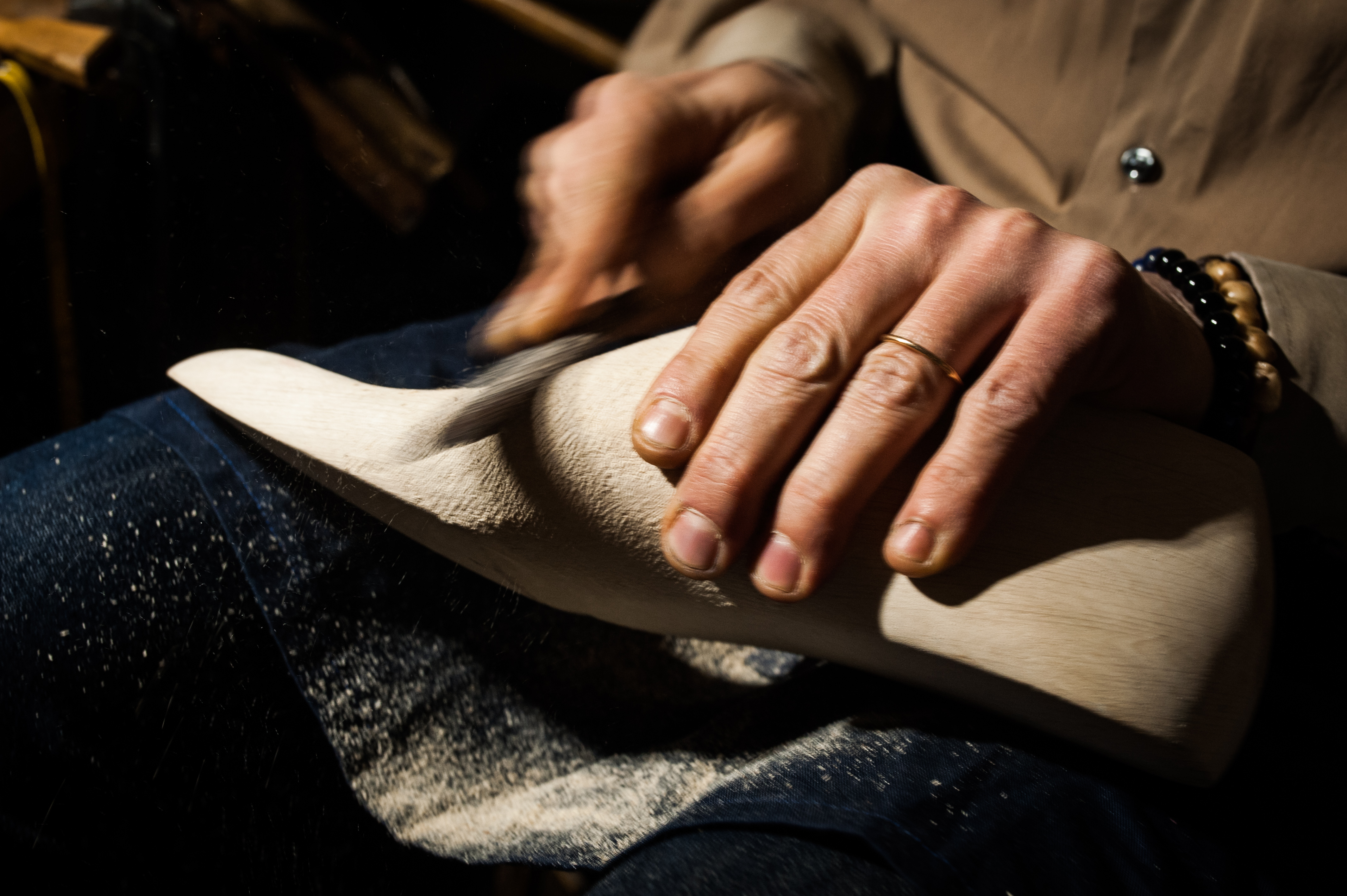 a person using a sand cutter to clean a foot