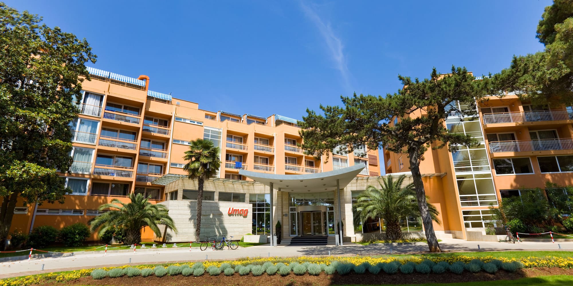 a building with trees and grass
