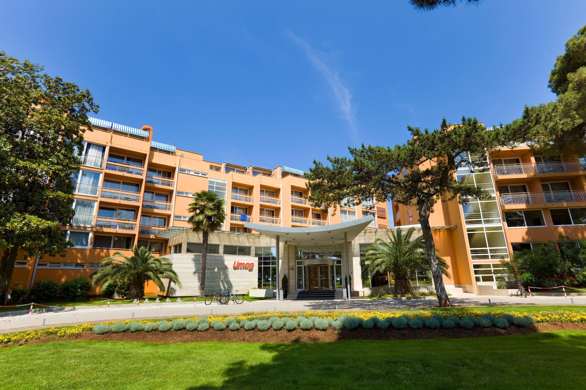a building with trees and grass