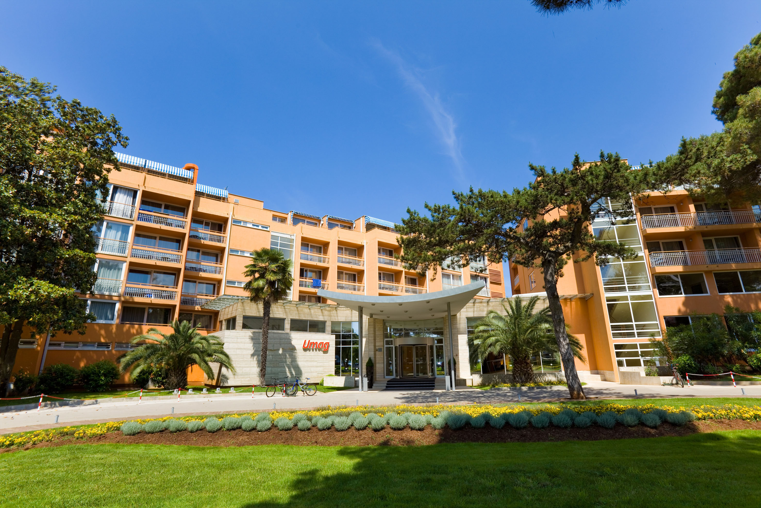 a building with trees and grass