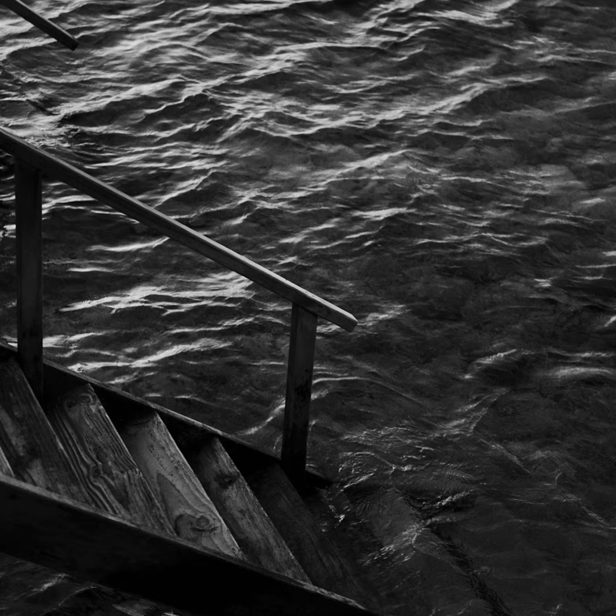 a stairs leading to a body of water