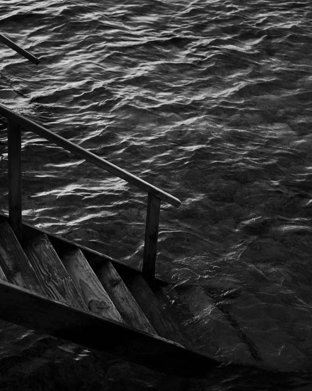 a stairs leading to a body of water