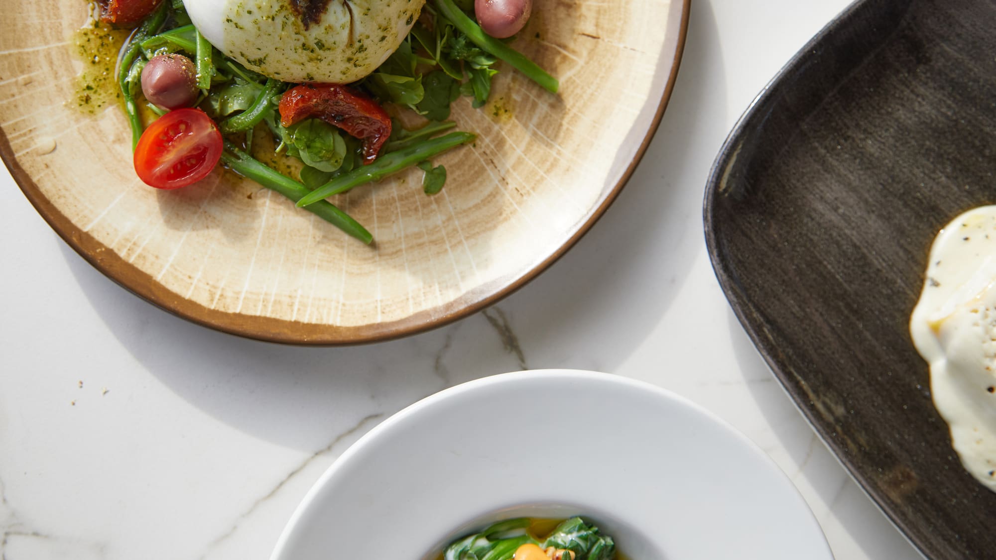 a plate of food on a marble table