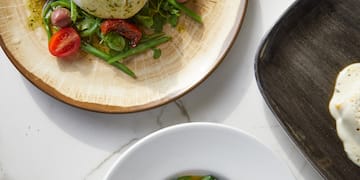 a plate of food on a marble table