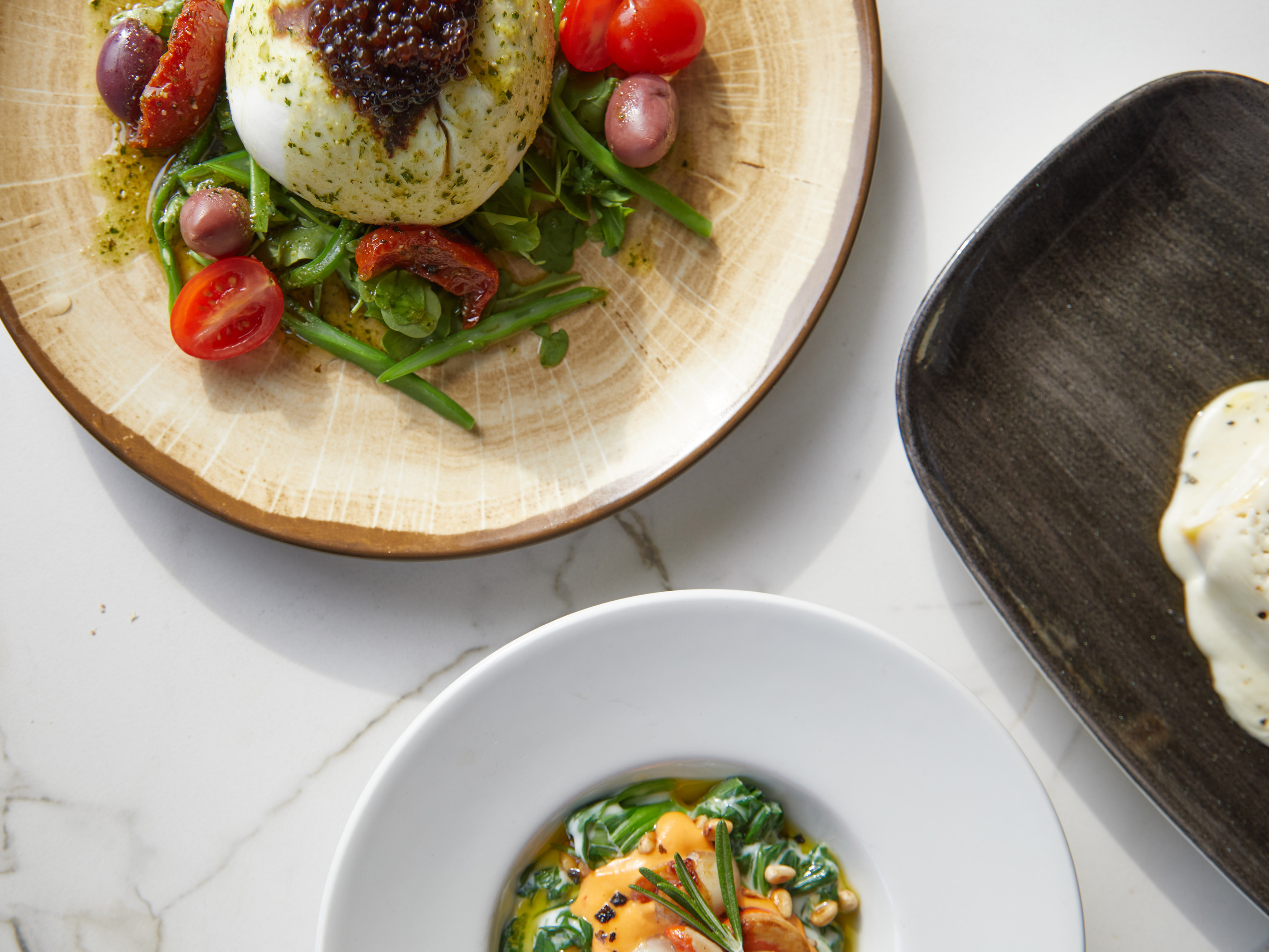 a plate of food on a marble table