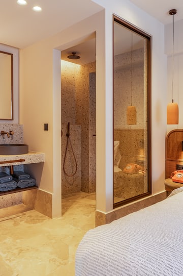 a bathroom with a shower and sink