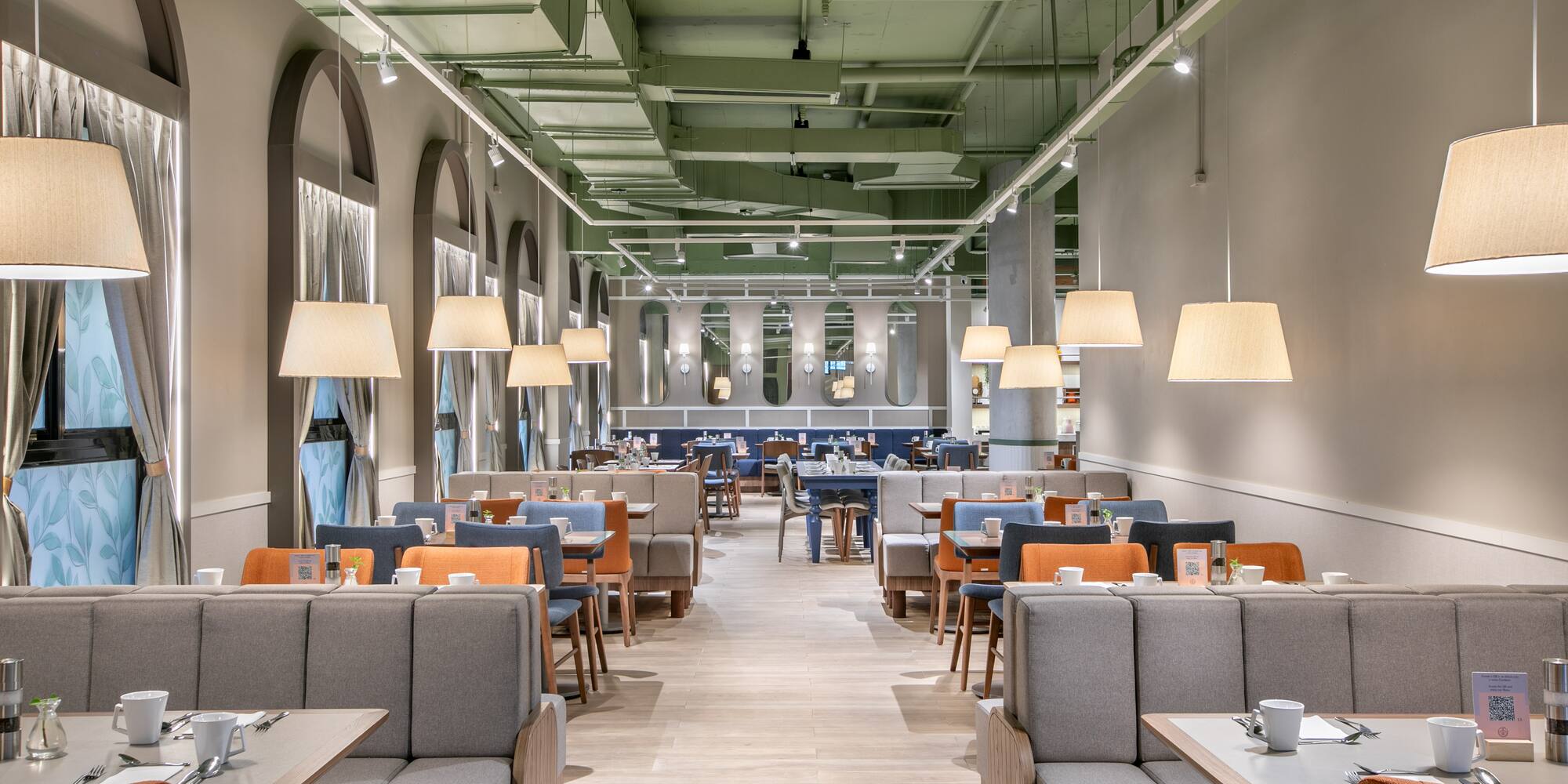 a restaurant with tables and chairs