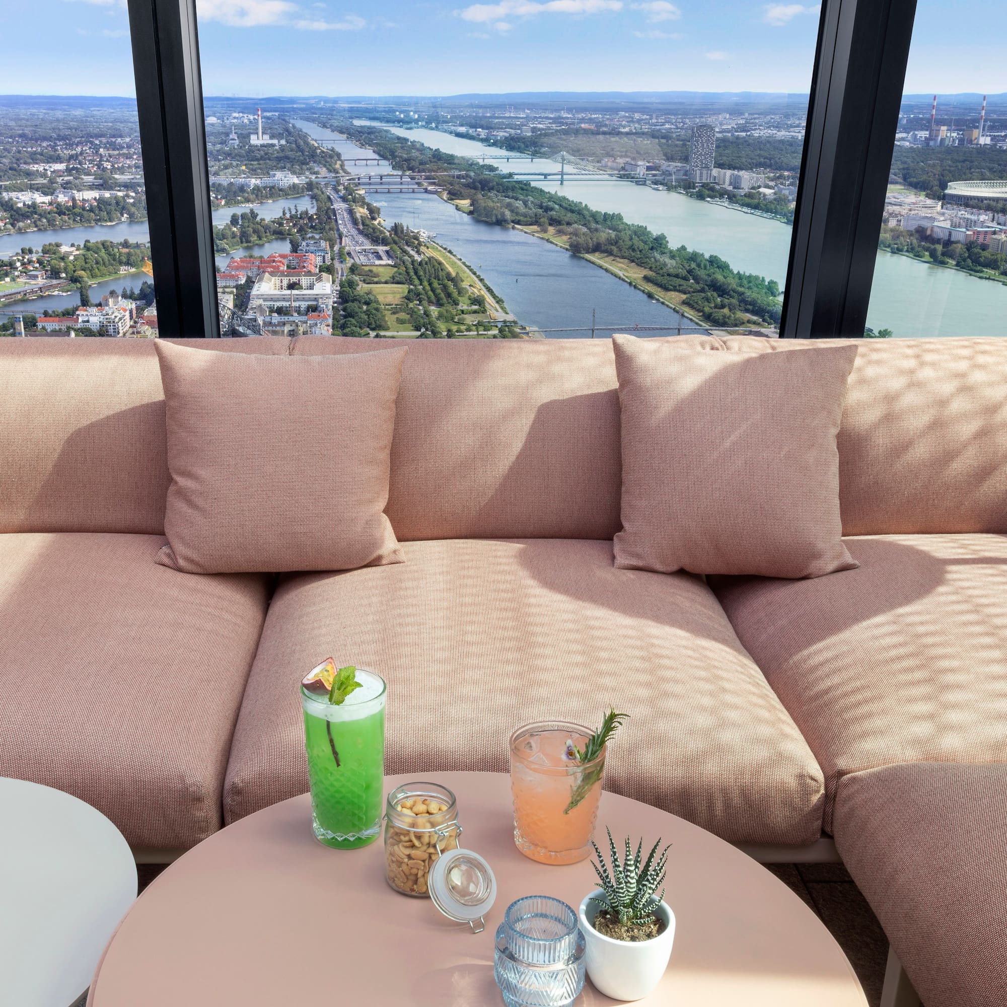 a couch with drinks on a table