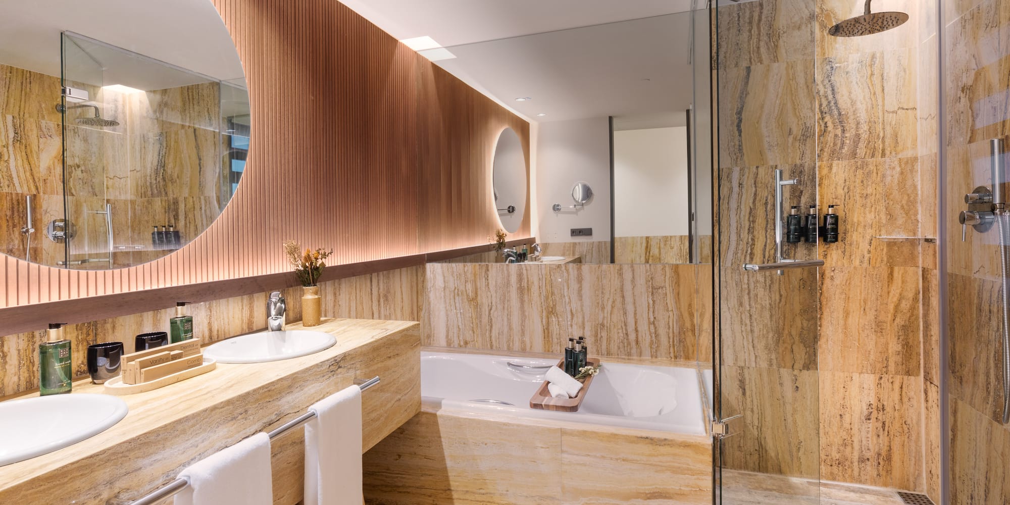 a bathroom with a tub and a shower