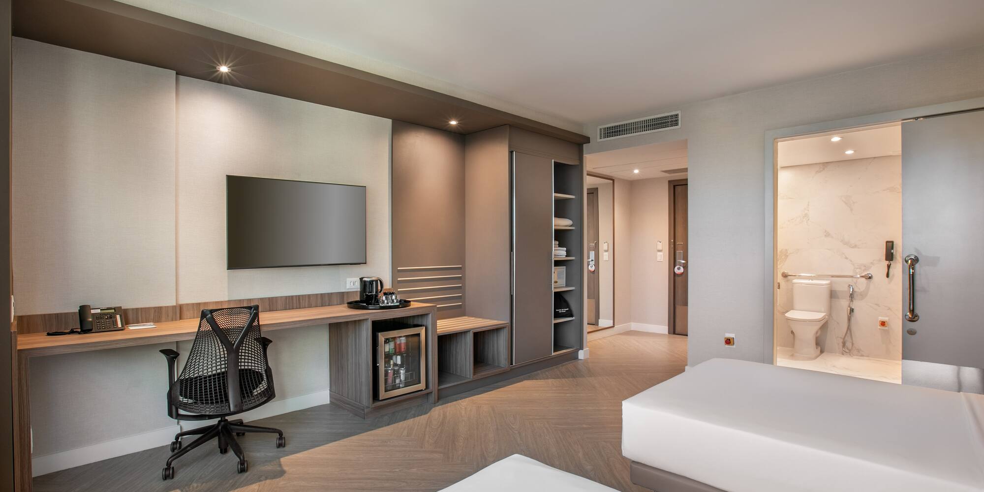 a room with a tv and a bed