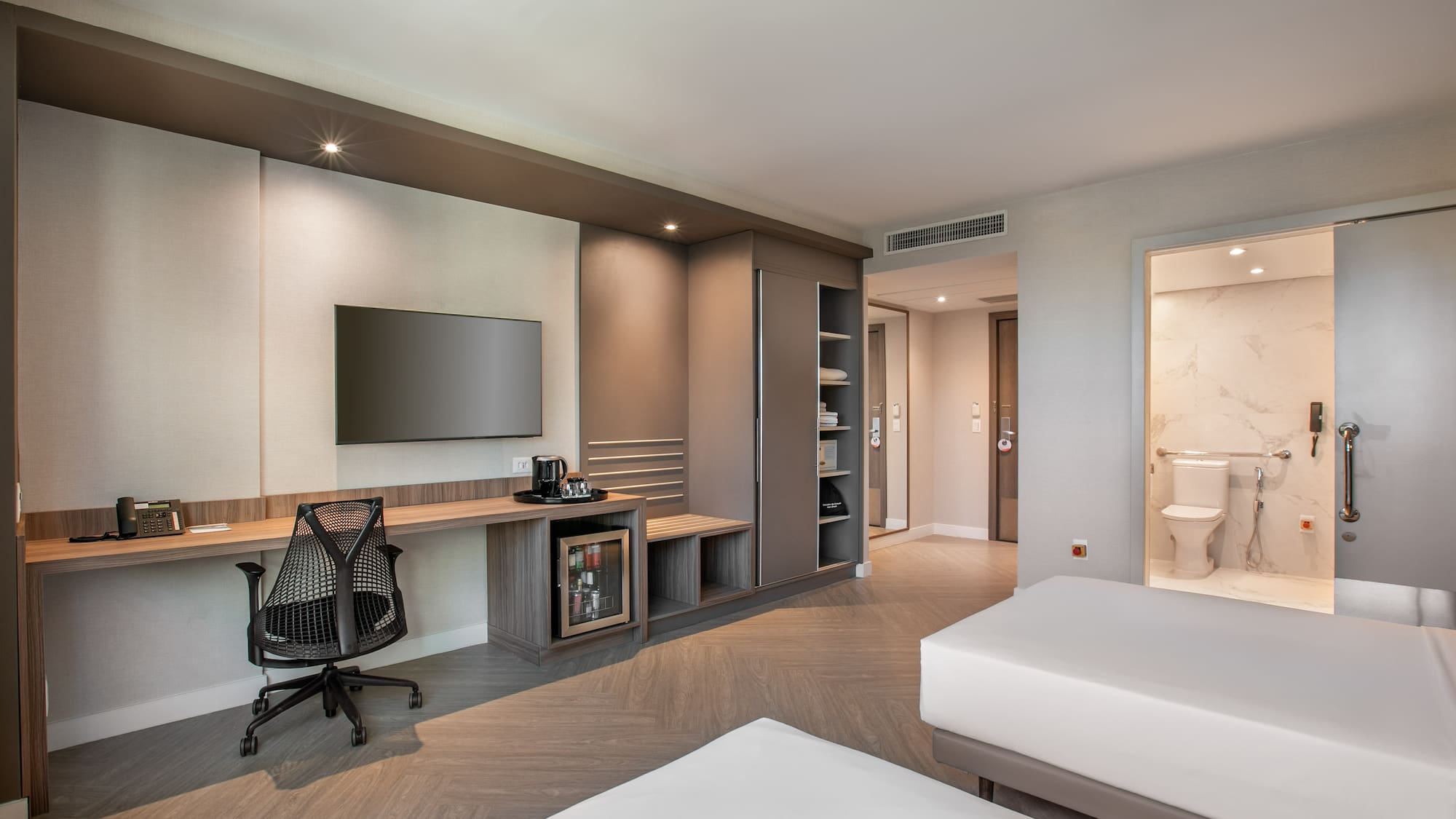 a room with a tv and a bed