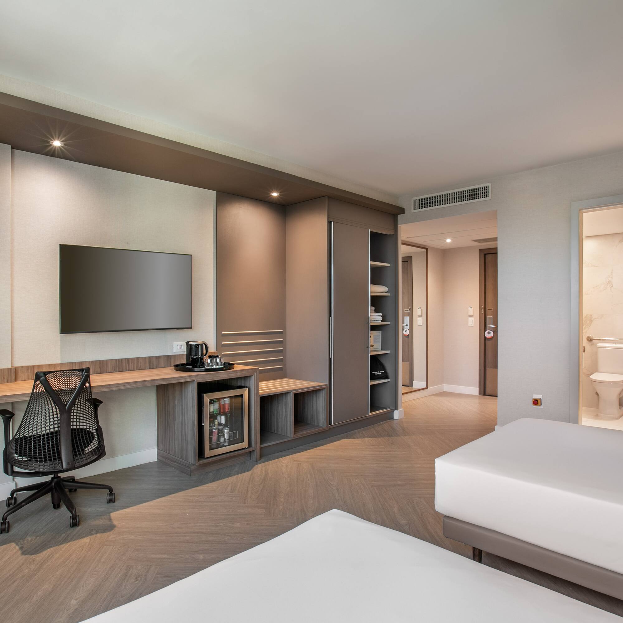 a room with a tv and a bed