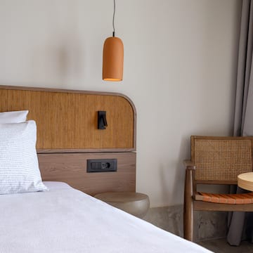 a bed with a chair and a table