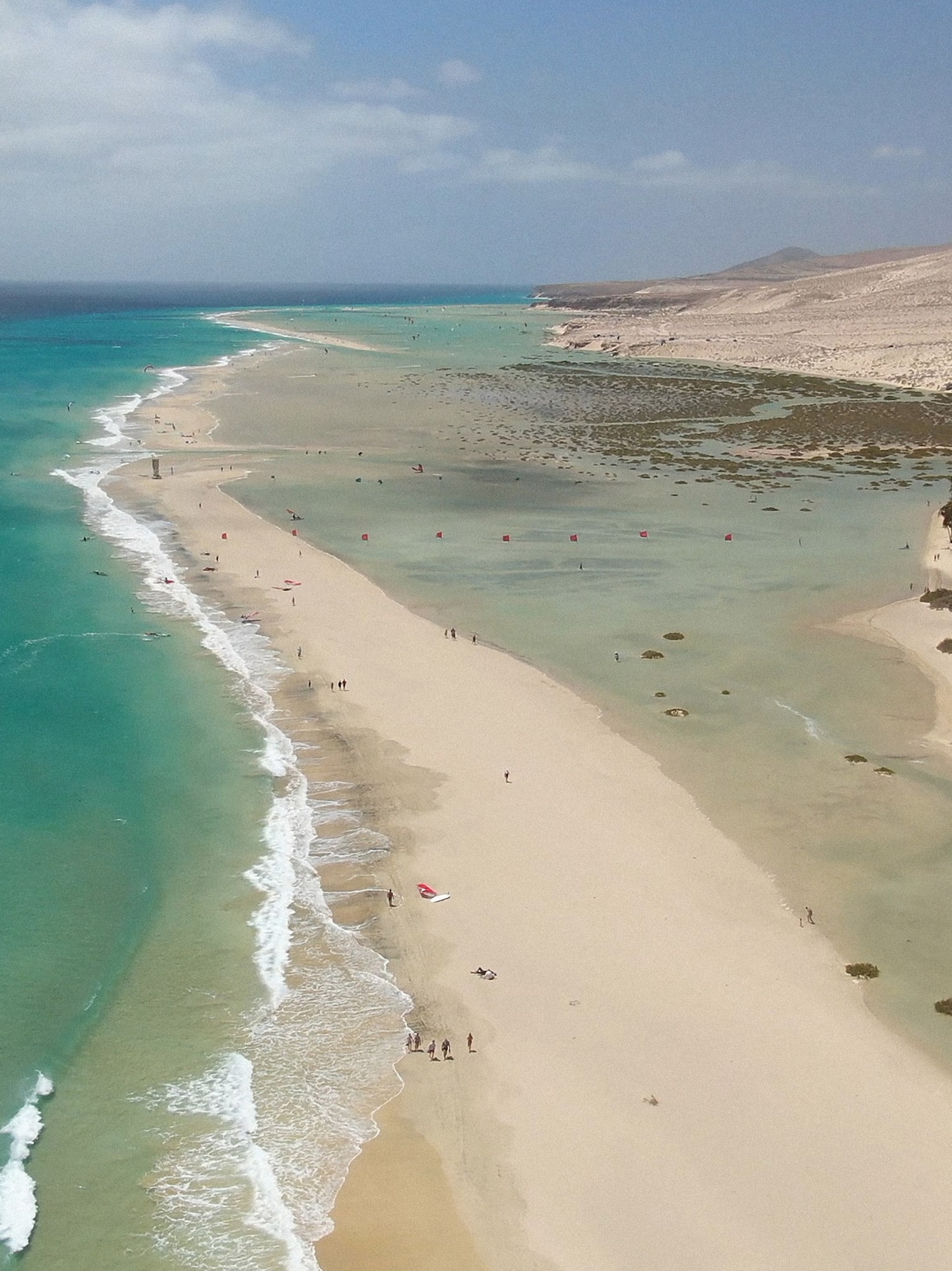 a beach with sand and water