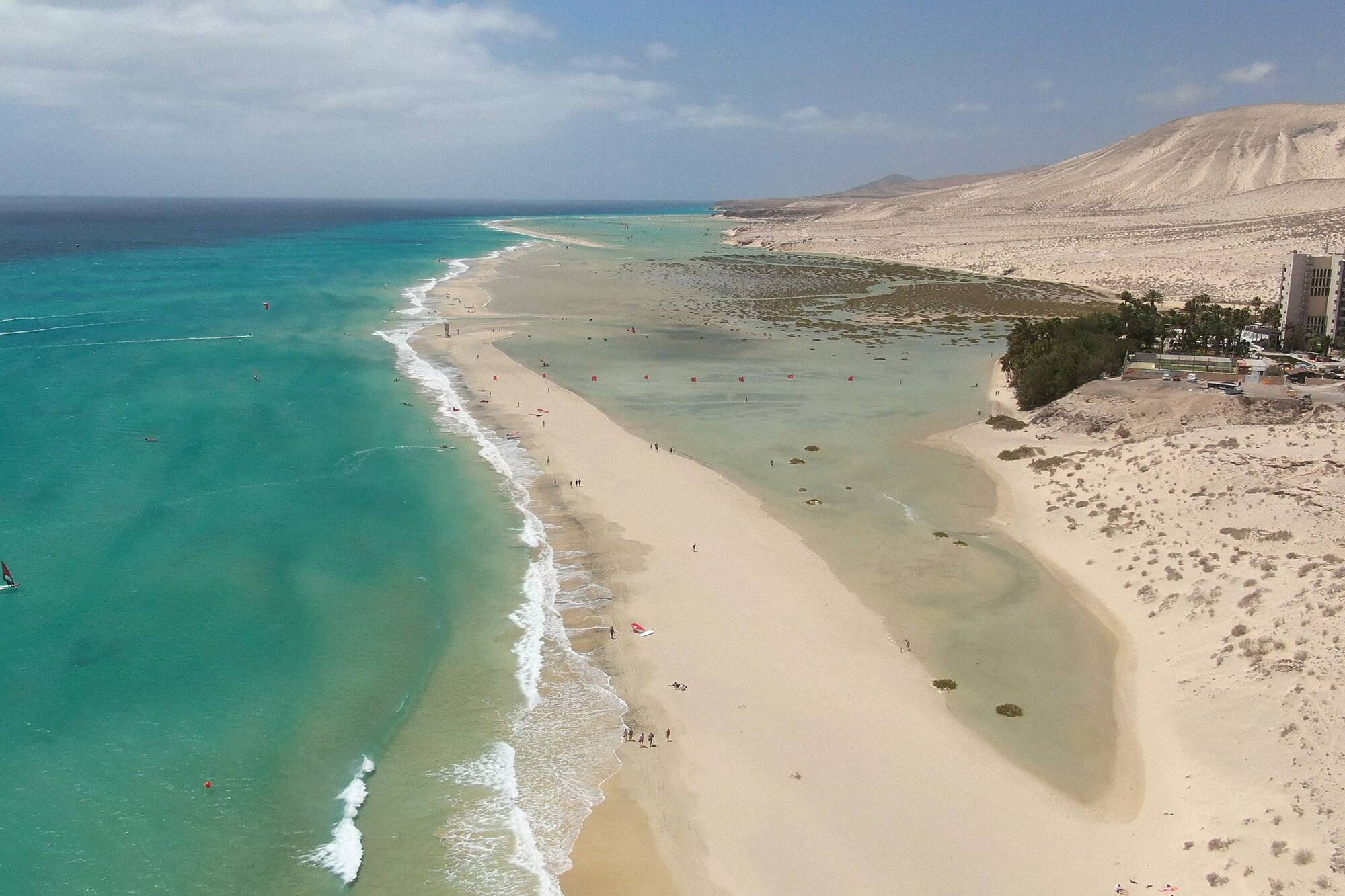a beach with sand and water