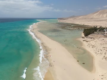 a beach with sand and water
