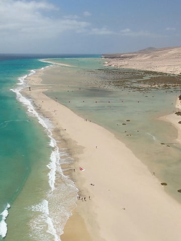 a beach with sand and water
