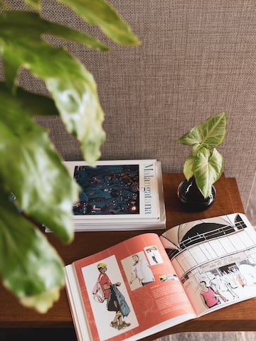 a book and a plant on a table