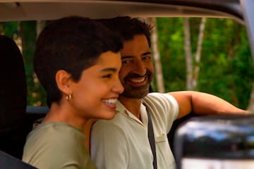 a man and woman in a car