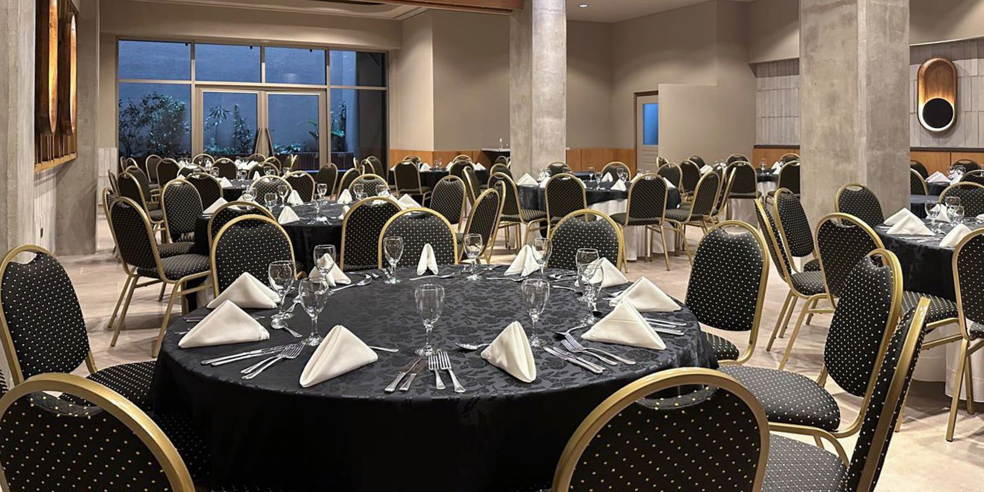 a room with a round table and chairs