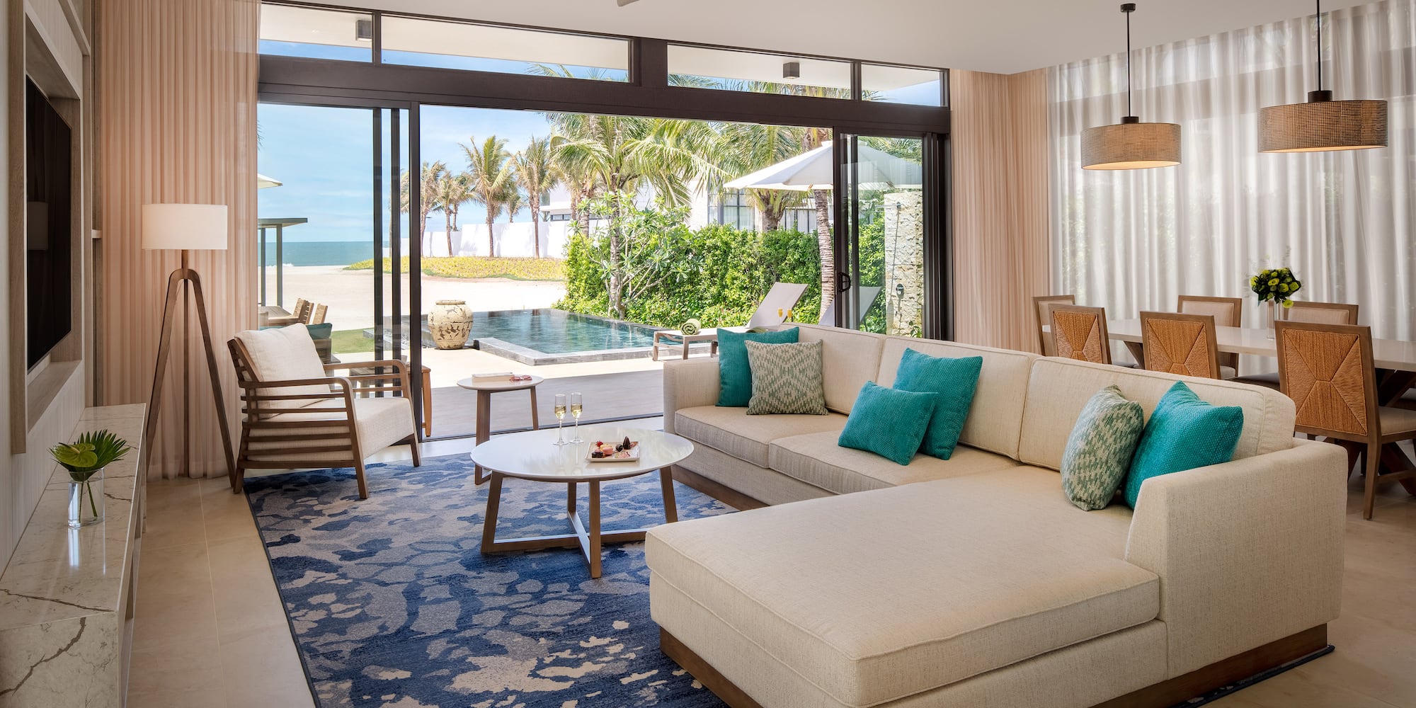 a living room with a large couch and a table