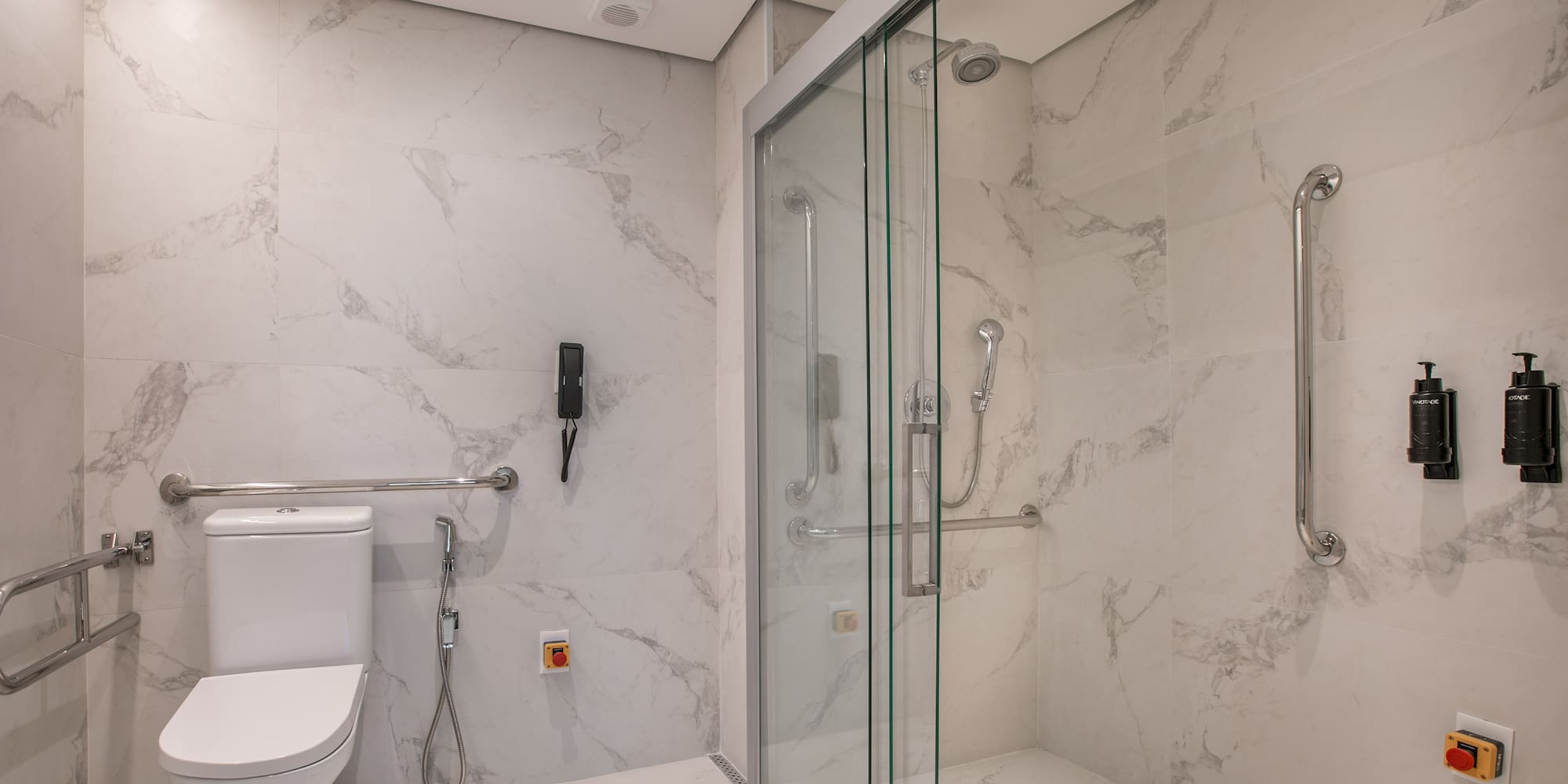 a bathroom with a toilet and shower