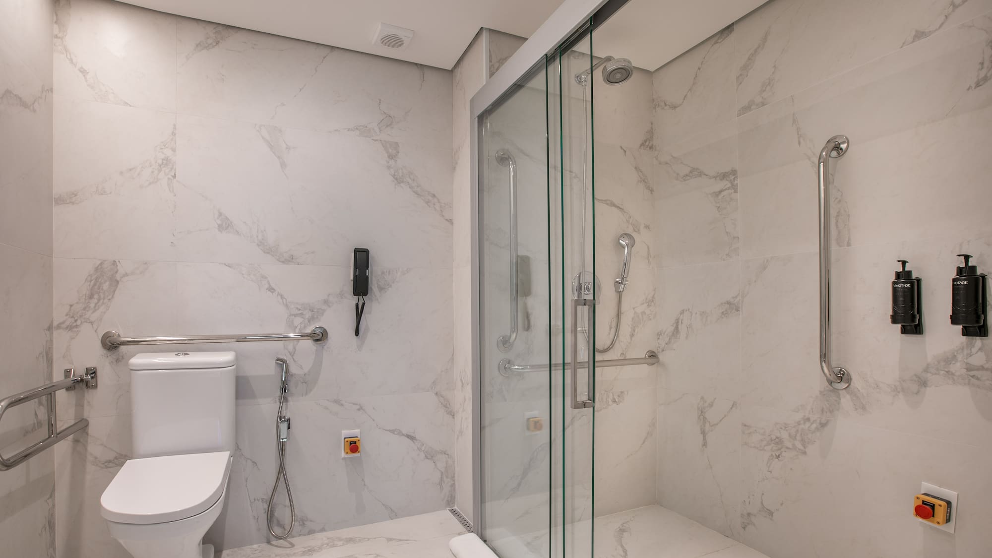 a bathroom with a toilet and shower