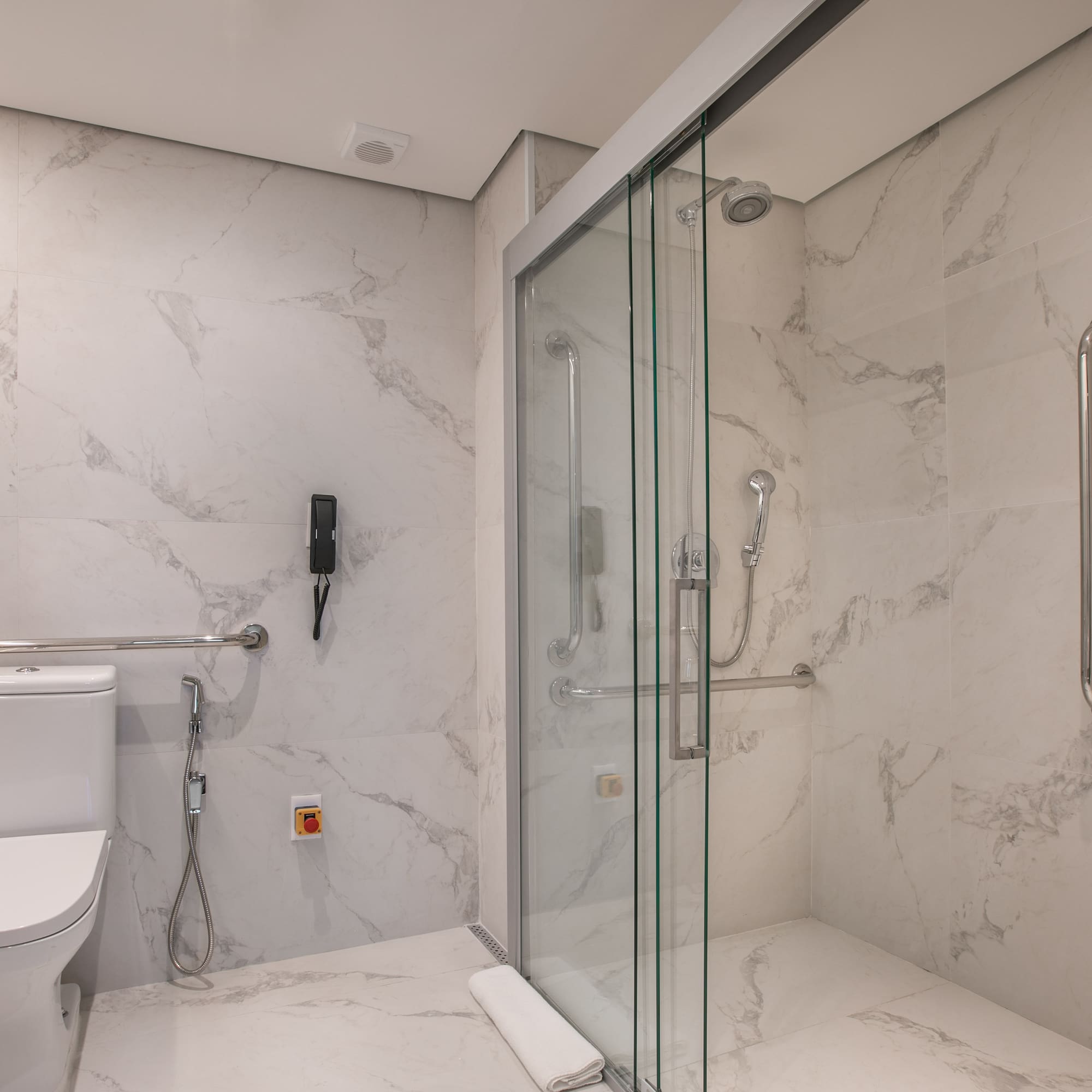 a bathroom with a toilet and shower