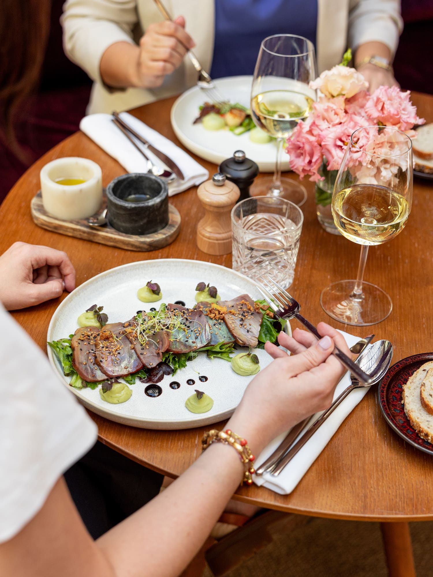 a person eating food on a plate