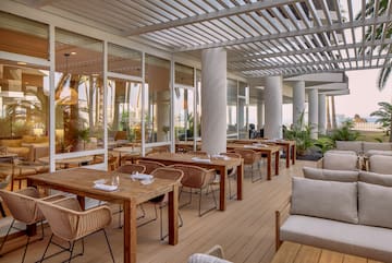 a restaurant with tables and chairs