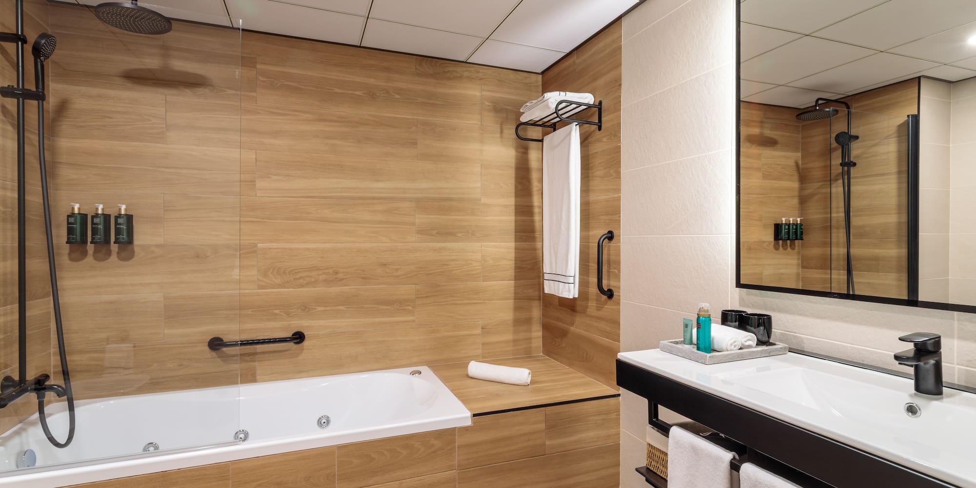 a bathroom with a bathtub and a mirror