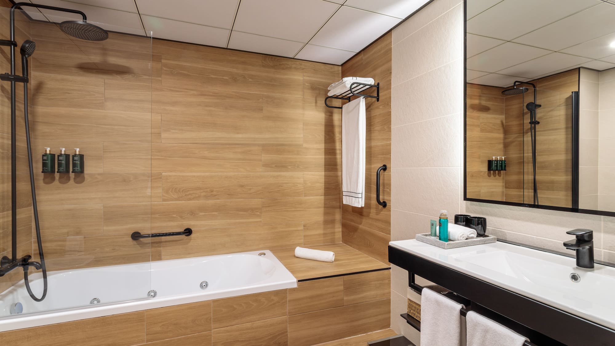 a bathroom with a bathtub and a mirror