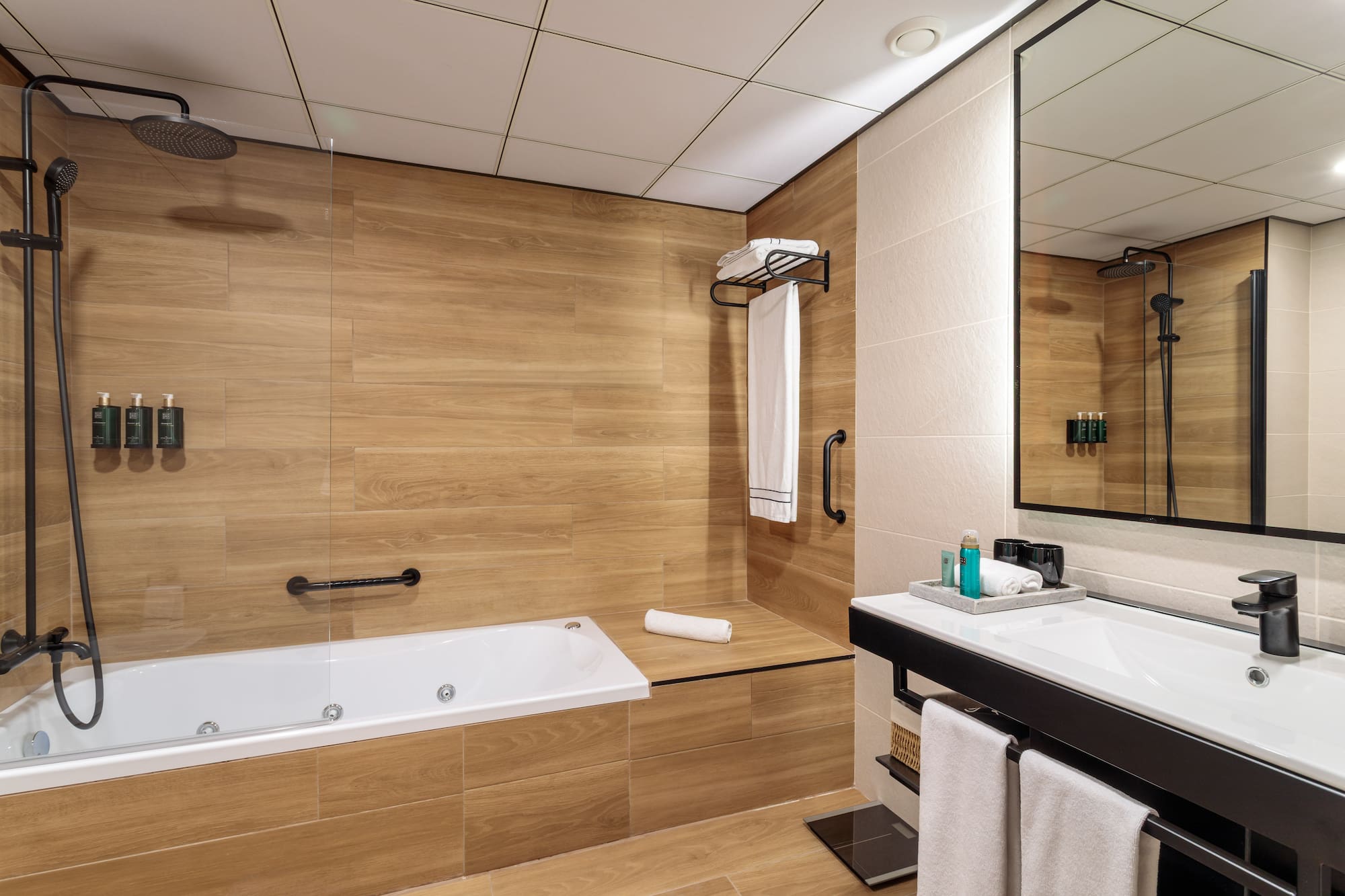 a bathroom with a bathtub and a mirror