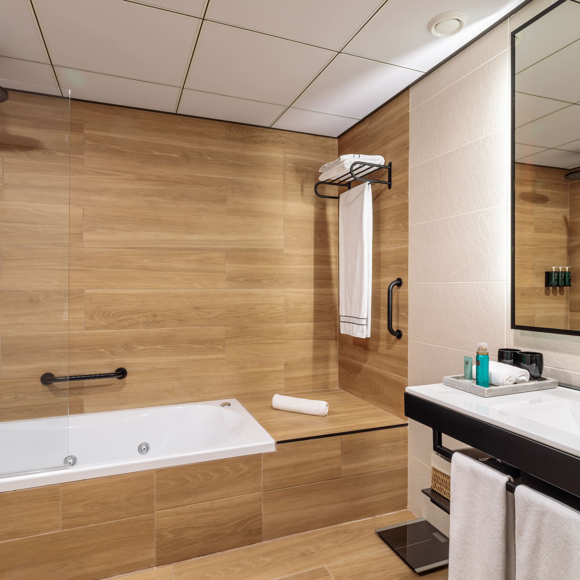 a bathroom with a bathtub and a mirror