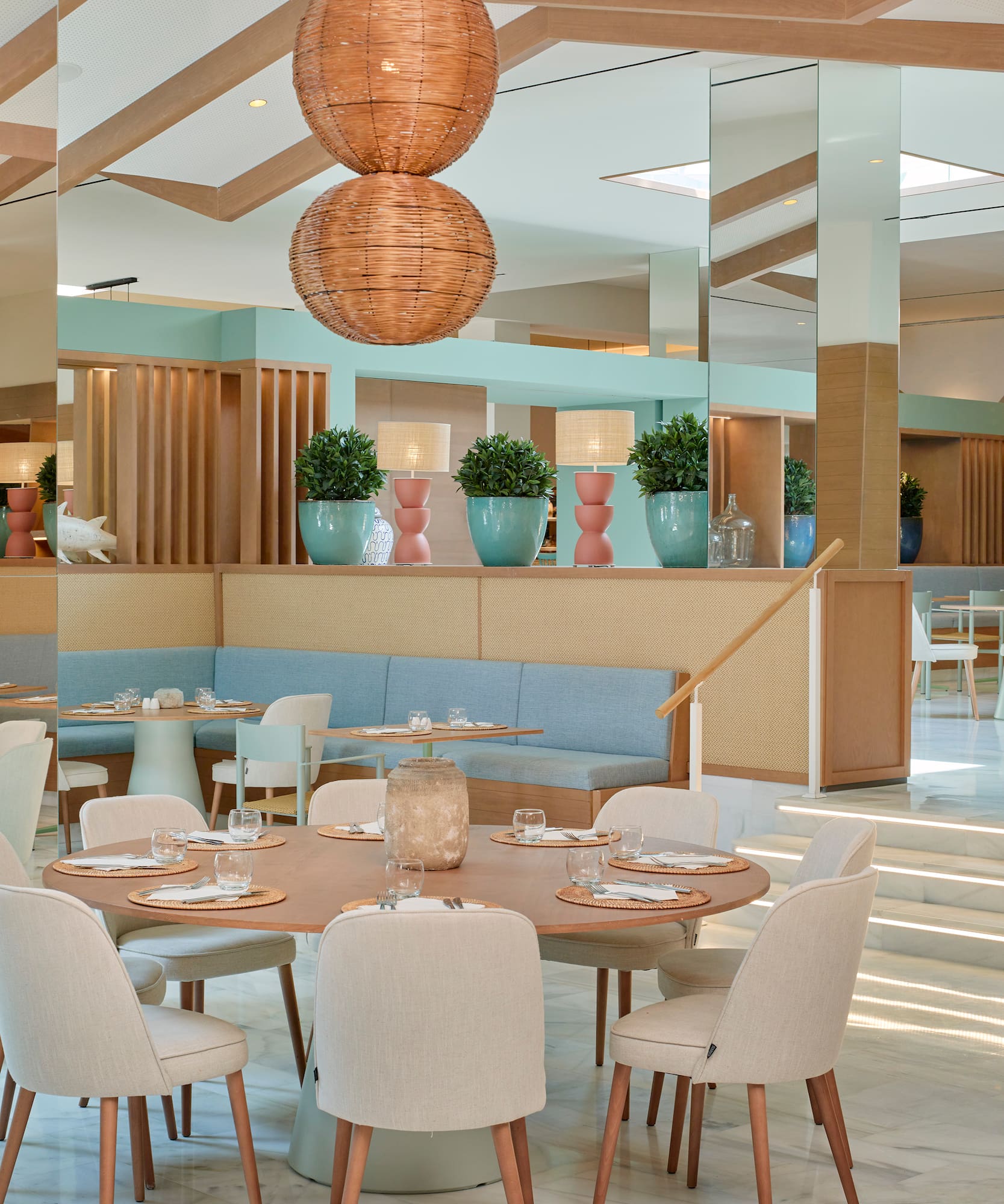 a restaurant with a large table and chairs